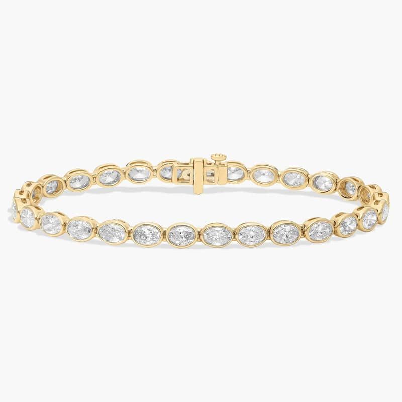 7 " Oval Cut Diamond E/W Bezel Set Tennis Bracelet In 14K Yellow Gold (8 Ct. tw. - H-I / SI1-SI2)